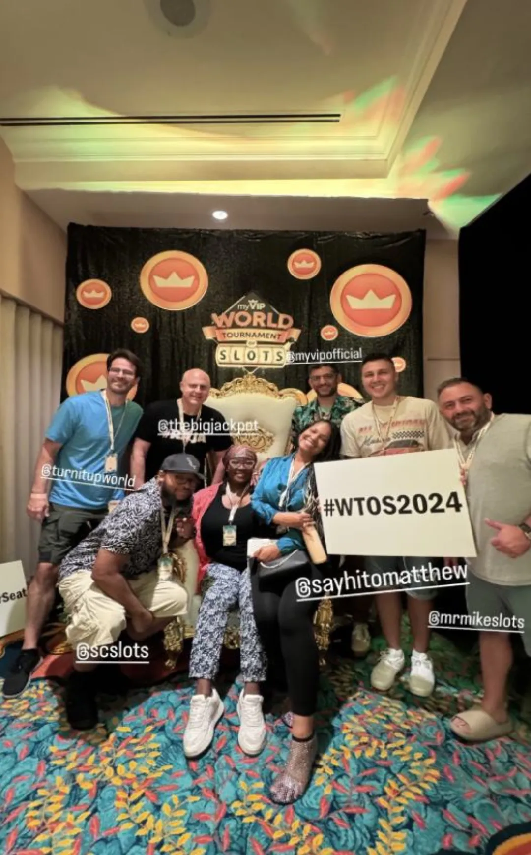 The Ambassadors of Luck — six creators together at Atlantis Paradise Island, Bahamas, holding a #WTOS2024 sign.